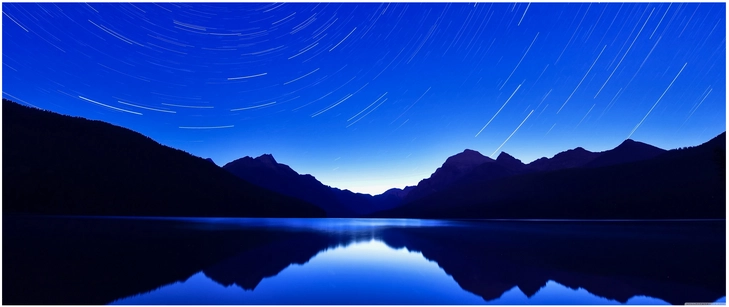bergsee mit sternenspuren und nachtlandschaft
