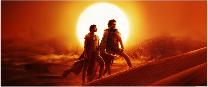 dramatische wuestenlandschaft mit figuren im sonnenuntergang