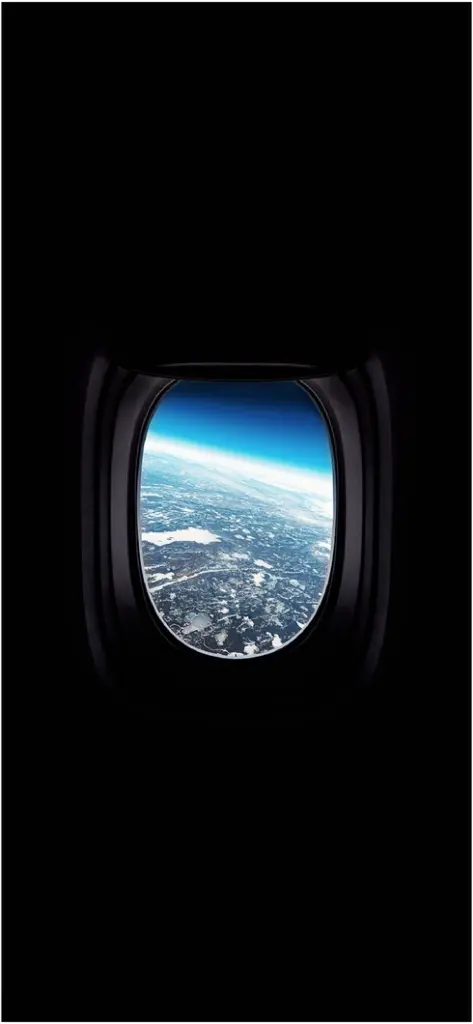 fascinierender blick auf die erde aus einem flugzeugfenster