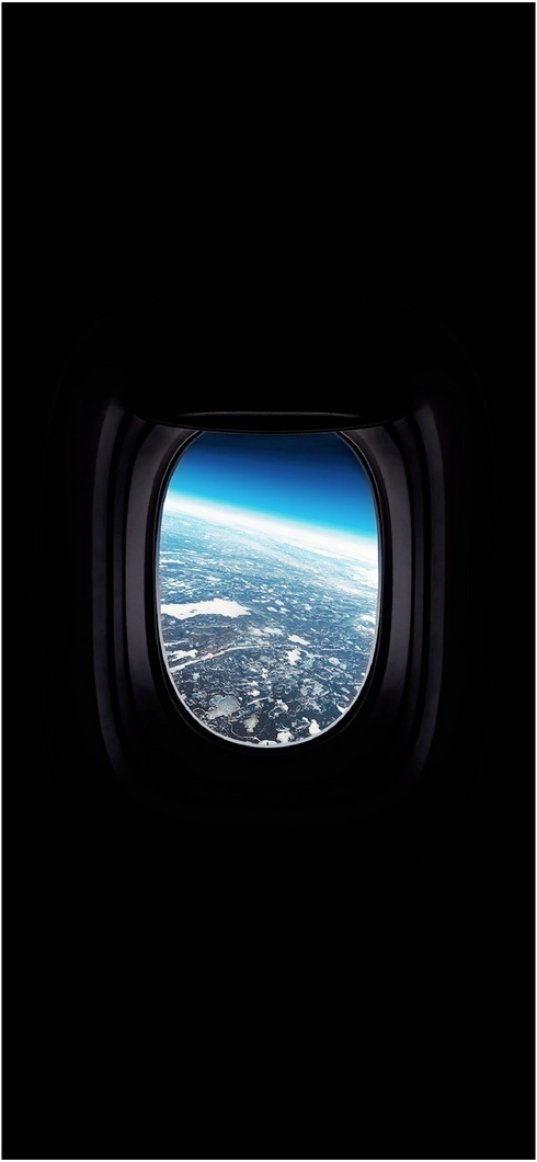 fascinierender-blick-auf-die-erde-aus-einem-flugzeugfenster