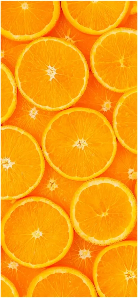 frische orangescheiben auf leuchtendem hintergrund