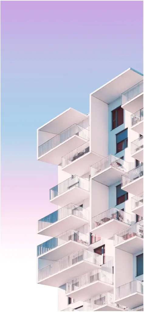 modernes hochhaus mit balkonen und farbverlauf