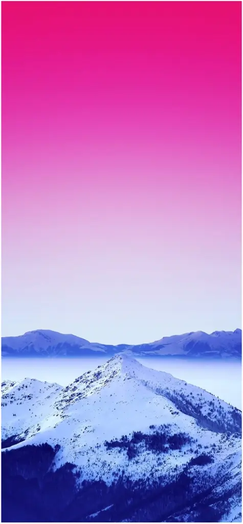 schneebedeckte berge unter pinkem himmel