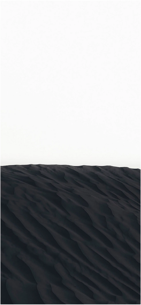 schwarze-sandduenen-unter-weiss-blauen-himmel