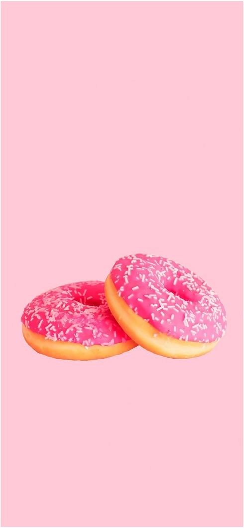 zwei-pinke-donuts-mit-streuseln-auf-pastellfarbenem-hintergrund
